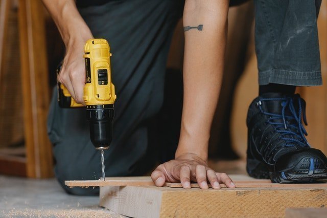 man fixing the floor